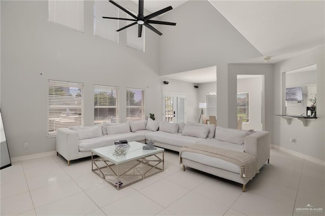 3500 Santa Lucia Cir, Mission, TX 78572 - living room featuring ceiling fan, light tile patterned floors, a towering ceiling, and baseboards