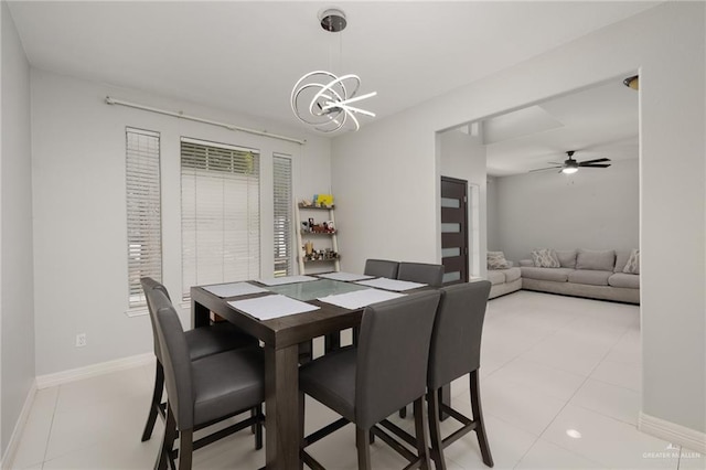 3500 Santa Lucia Cir, Mission, TX 78572 - dining room with a chandelier, ceiling fan, baseboards, and light tile patterned floors