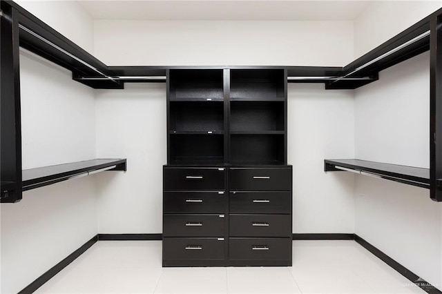 walk in closet featuring light tile patterned floors