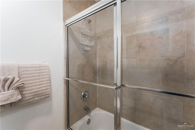 5909 Padre Blvd Unit 201, South Padre Island, TX 78597 - bathroom featuring combined bath / shower with glass door