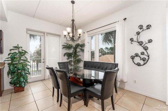 5909 Padre Blvd Unit 201, South Padre Island, TX 78597 - dining area with a chandelier, plenty of natural light, and light tile patterned flooring