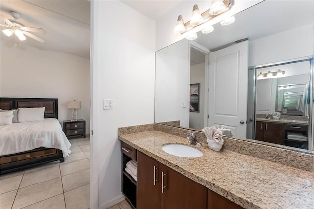 5909 Padre Blvd Unit 201, South Padre Island, TX 78597 - ensuite bathroom with tile patterned floors, vanity, and ceiling fan