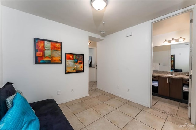 5909 Padre Blvd Unit 201, South Padre Island, TX 78597 - living area featuring light tile patterned floors and baseboards