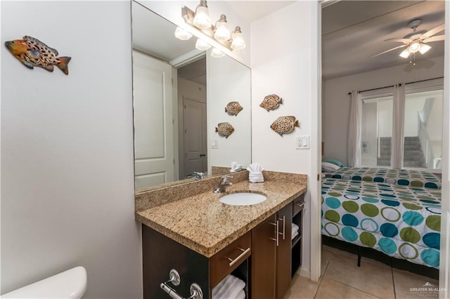 5909 Padre Blvd Unit 201, South Padre Island, TX 78597 - bathroom with vanity, tile patterned floors, ceiling fan, and toilet