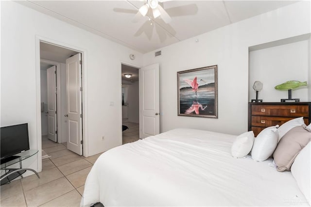 5909 Padre Blvd Unit 201, South Padre Island, TX 78597 - bedroom featuring light tile patterned floors and ceiling fan