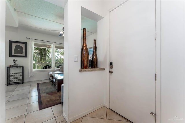 5909 Padre Blvd Unit 201, South Padre Island, TX 78597 - bathroom with tile patterned flooring, a ceiling fan, and baseboards