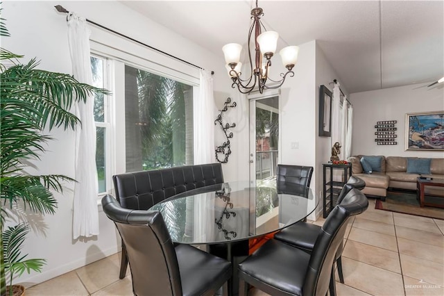 5909 Padre Blvd Unit 201, South Padre Island, TX 78597 - dining area featuring light tile patterned floors and a chandelier