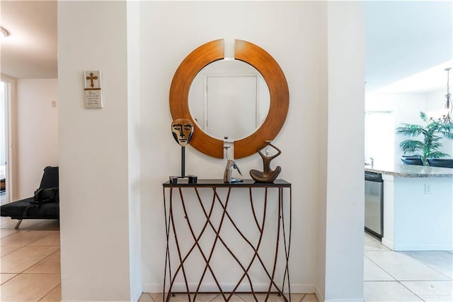5909 Padre Blvd Unit 201, South Padre Island, TX 78597 - hallway featuring light tile patterned floors and baseboards