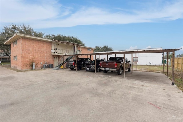 view of vehicle parking with a carport