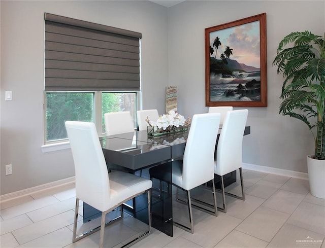 dining area featuring light tile patterned floors