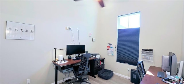 home office with wood finished floors and baseboards