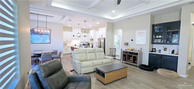 living area with light wood-style flooring, recessed lighting, indoor bar, coffered ceiling, and ornamental molding