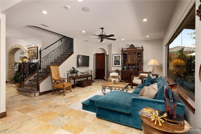 1509 Duke Ave, Mcallen, TX 78504 - living area with arched walkways, recessed lighting, stairway, ceiling fan, and stone finish flooring