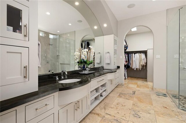 1509 Duke Ave, Mcallen, TX 78504 - full bathroom with a shower stall, double vanity, a spacious closet, and recessed lighting
