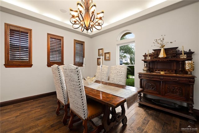1509 Duke Ave, Mcallen, TX 78504 - dining space with a chandelier, dark wood-type flooring, and a tray ceiling