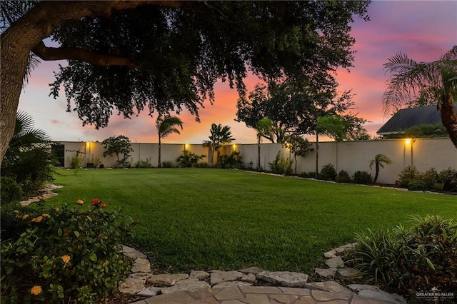 1509 Duke Ave, Mcallen, TX 78504 - yard at dusk featuring a fenced backyard