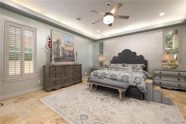 1509 Duke Ave, Mcallen, TX 78504 - bedroom featuring a raised ceiling, ceiling fan, recessed lighting, and stone finish flooring