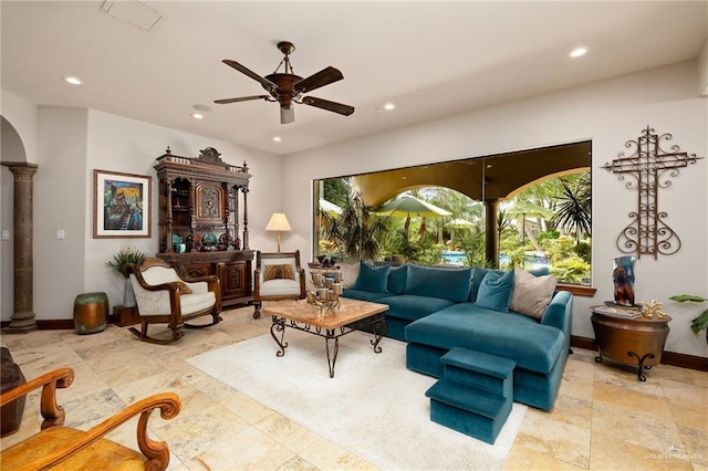 1509 Duke Ave, Mcallen, TX 78504 - living area with a ceiling fan, recessed lighting, decorative columns, and stone finish flooring