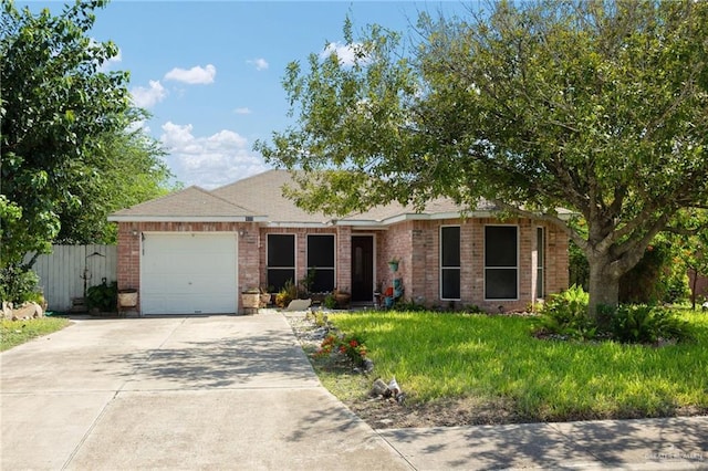 ranch-style home featuring driveway, brick siding, an attached garage, and fence