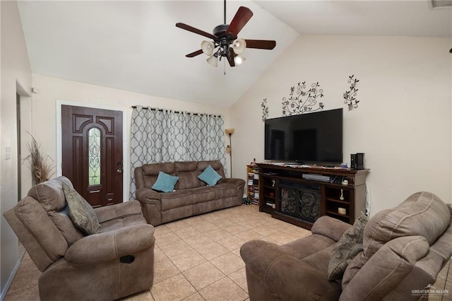 living room with ceiling fan, light tile patterned flooring, and vaulted ceiling