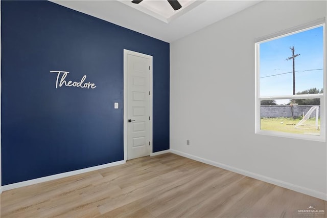 5112 W Burberry St, Edinburg, TX 78541 - unfurnished room featuring light wood finished floors, plenty of natural light, and ceiling fan