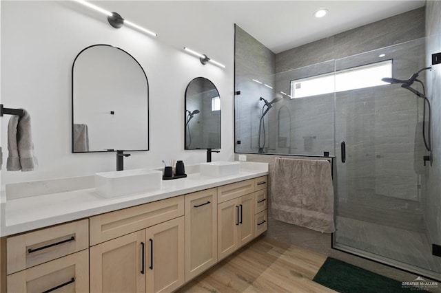 5112 W Burberry St, Edinburg, TX 78541 - bathroom featuring double vanity, a shower stall, wood finished floors, and recessed lighting