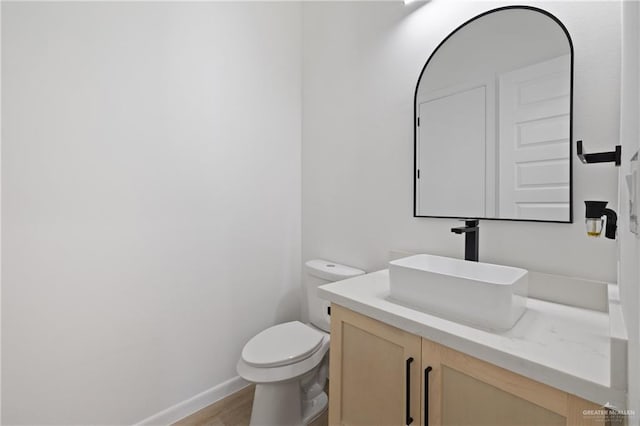 5112 W Burberry St, Edinburg, TX 78541 - half bathroom featuring vanity and wood finished floors