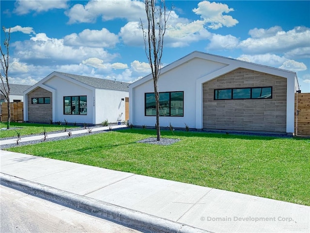 single story home with a front lawn