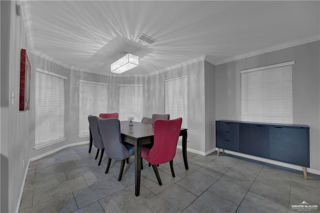 tiled dining area with crown molding and a chandelier