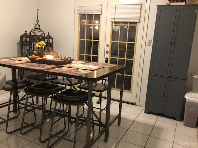 dining room featuring light tile patterned floors