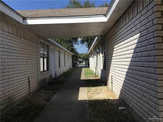 view of side of property featuring a carport