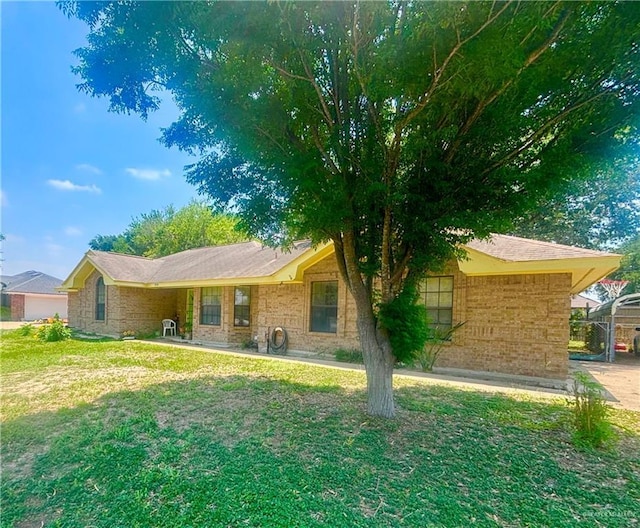 single story home featuring a front lawn and brick siding