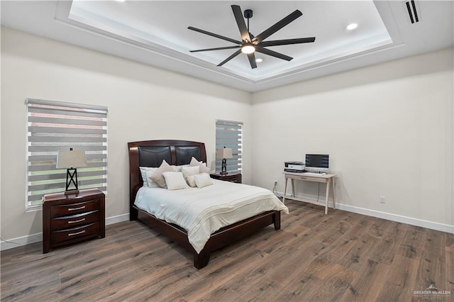 1620 Stonegate Dr, Mission, TX 78574 - bedroom with a raised ceiling, wood finished floors, an office area, baseboards, and recessed lighting
