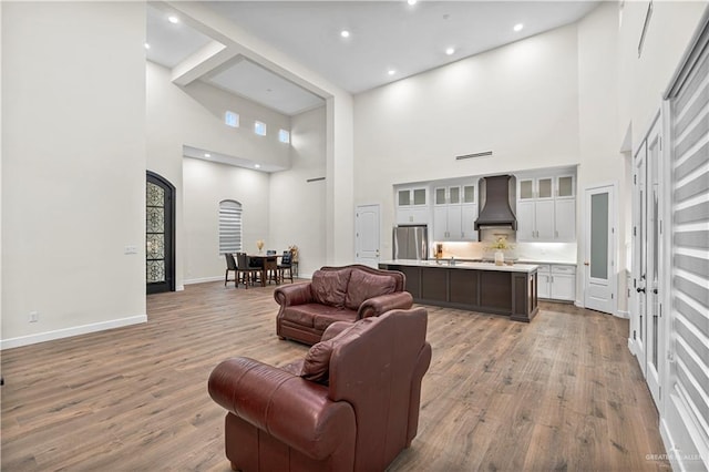 1620 Stonegate Dr, Mission, TX 78574 - living room with a high ceiling, wood finished floors, baseboards, and recessed lighting