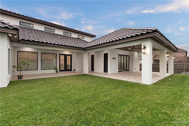 1620 Stonegate Dr, Mission, TX 78574 - back of house with french doors, a patio, stucco siding, a tile roof, and ceiling fan