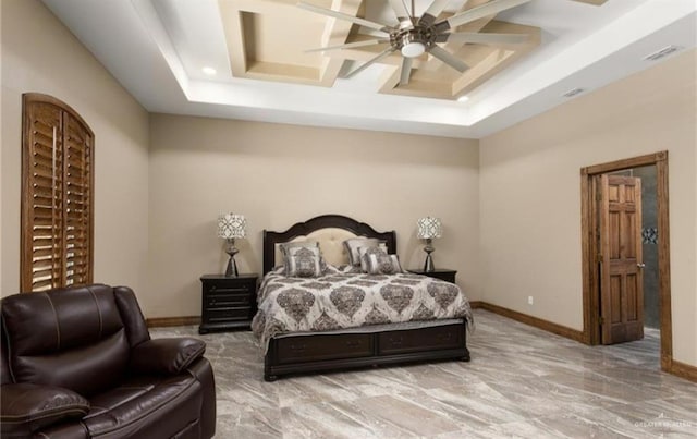 bedroom featuring ceiling fan and a tray ceiling