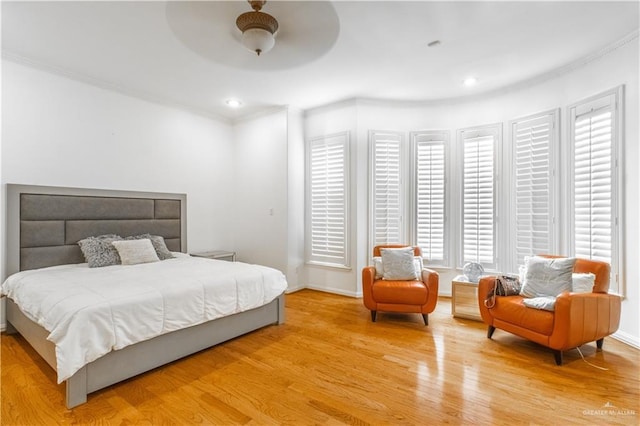 bedroom with ceiling fan and light wood-type flooring