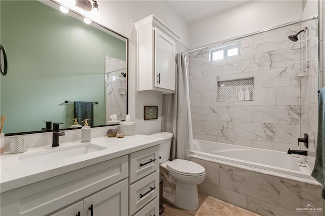 full bathroom featuring vanity, shower / bath combo, and toilet