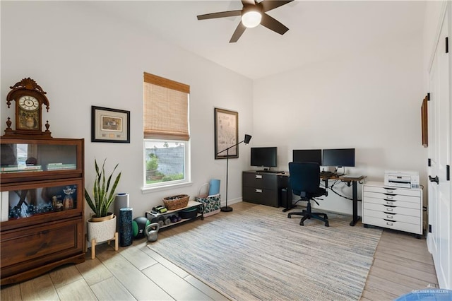 office area with ceiling fan and light wood-type flooring