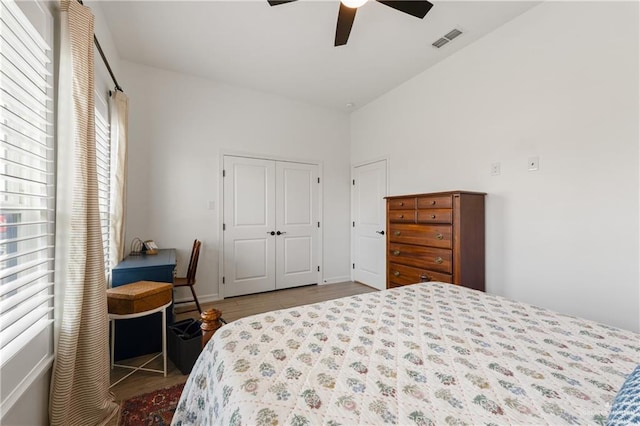 bedroom featuring ceiling fan and a closet