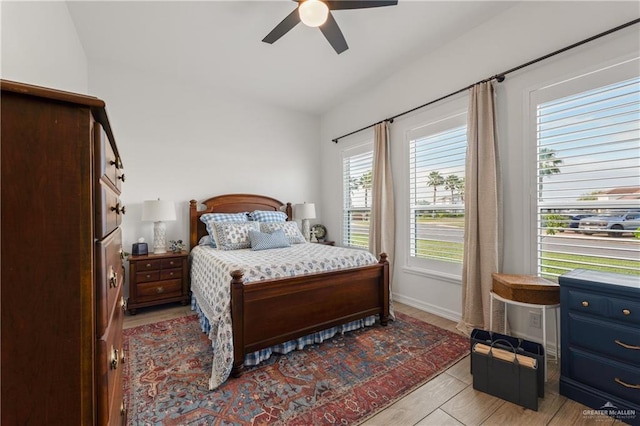 bedroom featuring ceiling fan and vaulted ceiling