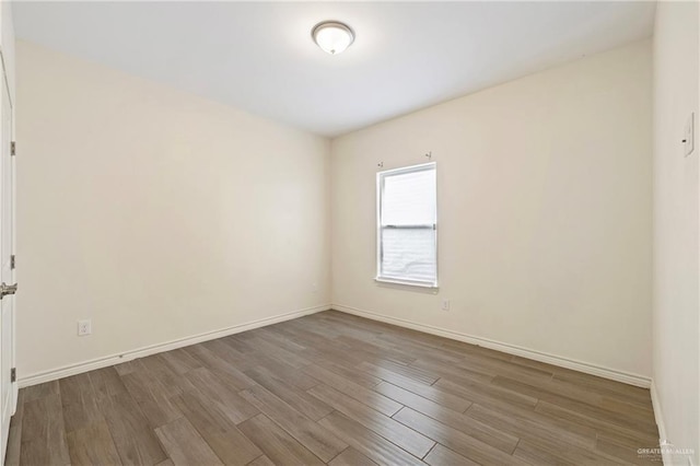 7303 Umar Ave, Mission, TX 78573 - empty room with wood finished floors and baseboards