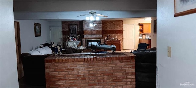 5906 N Brushline Rd, Mission, TX 78574 - living area with ceiling fan and a brick fireplace