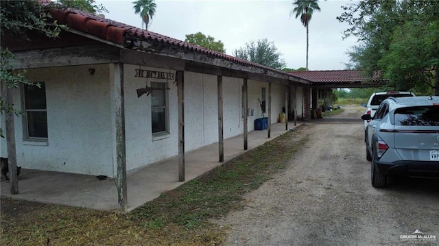 5906 N Brushline Rd, Mission, TX 78574 - view of side of home featuring stucco siding