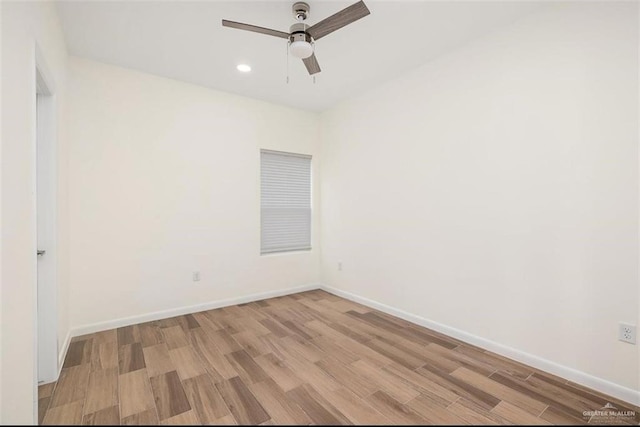 unfurnished room with ceiling fan and light wood-type flooring