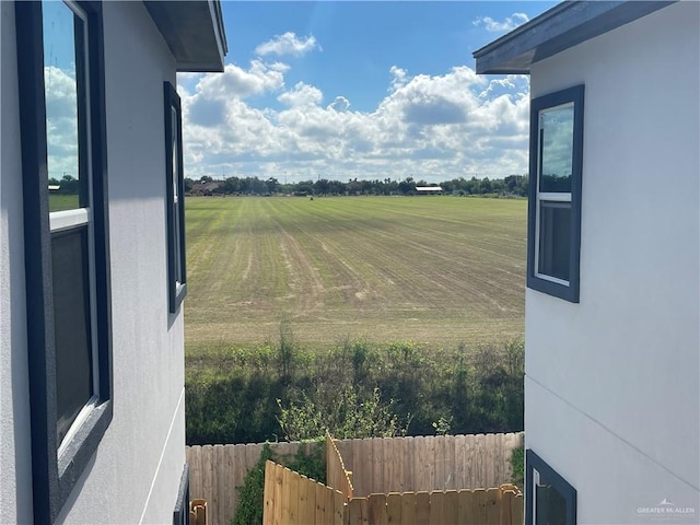 view of yard with a rural view