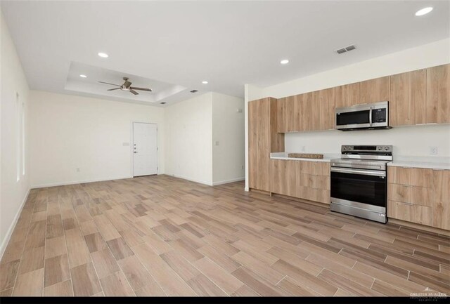 2913 E Israel Ave, Alton, TX 78573 - kitchen with appliances with stainless steel finishes, light brown cabinetry, modern cabinets, and recessed lighting