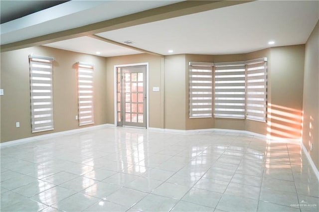 unfurnished room featuring light tile patterned flooring