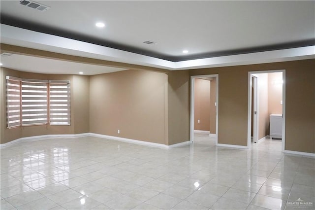 empty room with light tile patterned floors