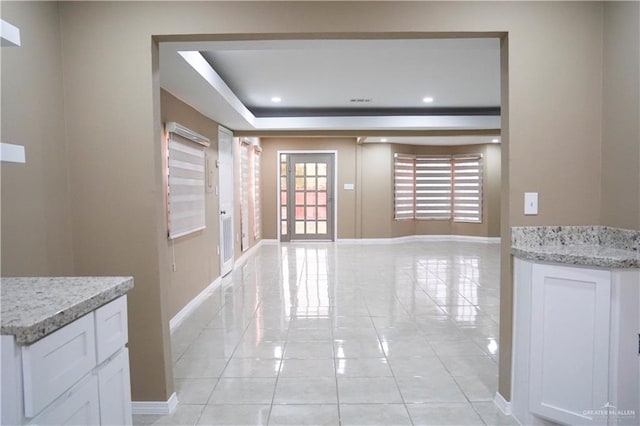 hallway with light tile patterned floors